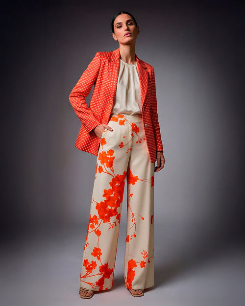 Conjunto de mujer color naranja con estampado de lunares y pantalon floral, elegante y versátil, ideal para uso diario o eventos formales. Milaches Primavera-Verano 2026